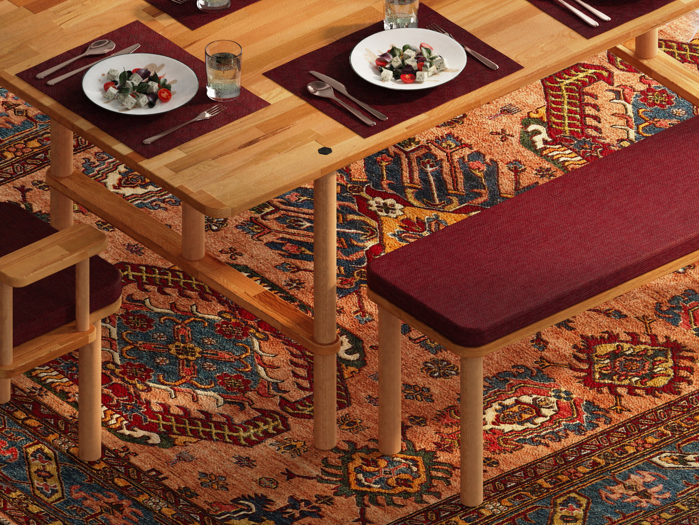 A beech dining table with a console and a burgundy upholstered chair