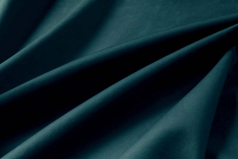 Velvet upholstery swatch in petrol blue